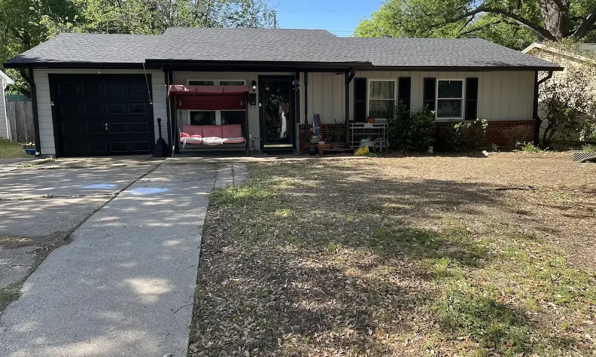 Asphalt Shingle Roof Repair crew at work on a residential roof in Spring Creek